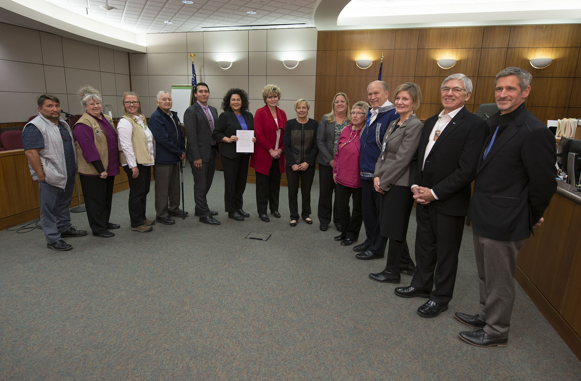 Kenaitze Indian Tribe's Executive Council, Executive Director, representatives of the Alaska state court system, and the states executive branch pose following the ceremony. Photo courtesy of KIT. 